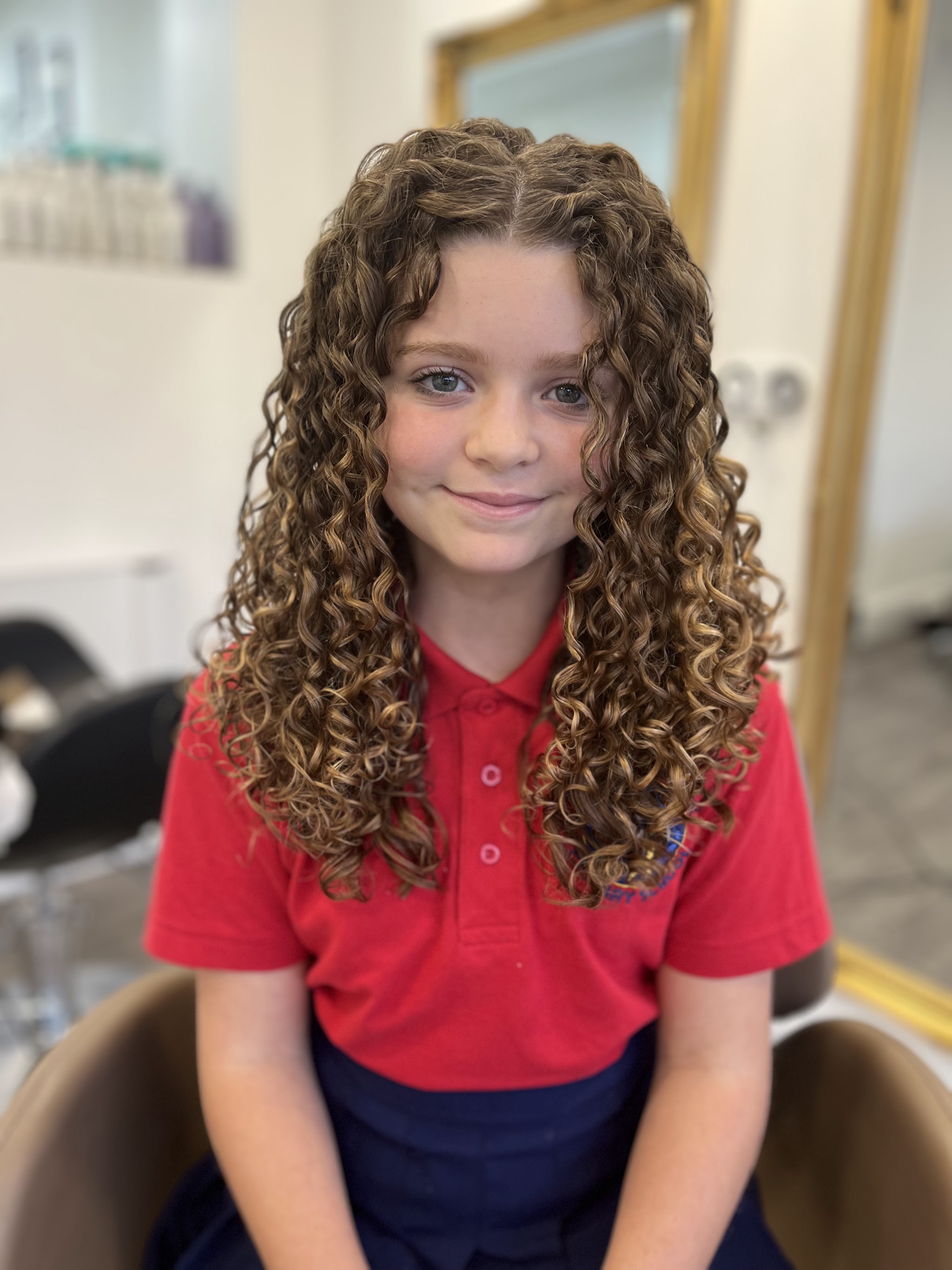 A young client's finished long curls at The Curl Therapist